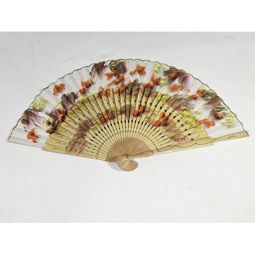194 - A collection of 4x good quality oriental fans to include a black lace fan with hand stitched floral ... 