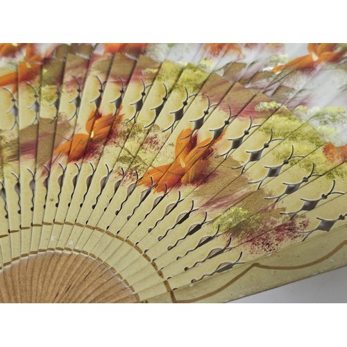 194 - A collection of 4x good quality oriental fans to include a black lace fan with hand stitched floral ... 