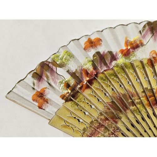 194 - A collection of 4x good quality oriental fans to include a black lace fan with hand stitched floral ... 