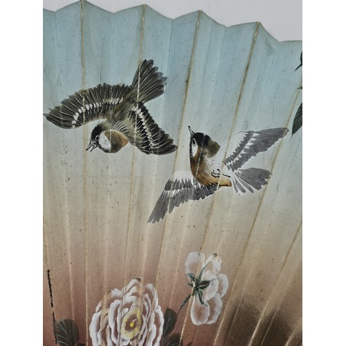 194 - A collection of 4x good quality oriental fans to include a black lace fan with hand stitched floral ... 