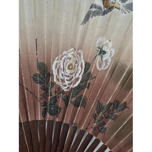 194 - A collection of 4x good quality oriental fans to include a black lace fan with hand stitched floral ... 