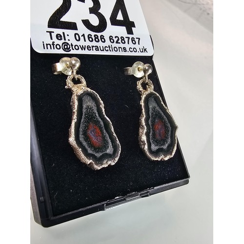 234 - An unusual attractive pair of 925 silver drop earrings featuring real geode crystal agate slice drop... 