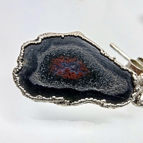 234 - An unusual attractive pair of 925 silver drop earrings featuring real geode crystal agate slice drop... 