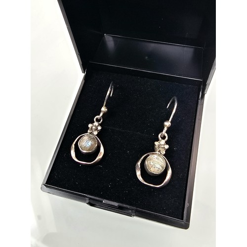 235 - A pair of pretty vintage 925 silver drop earrings, having a flower design set with rainbow moonstone... 