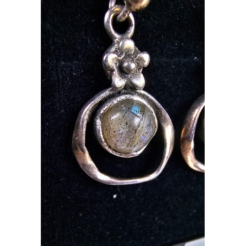 235 - A pair of pretty vintage 925 silver drop earrings, having a flower design set with rainbow moonstone... 