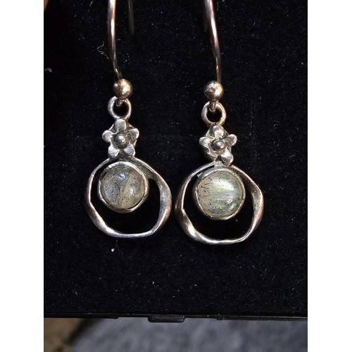 235 - A pair of pretty vintage 925 silver drop earrings, having a flower design set with rainbow moonstone... 
