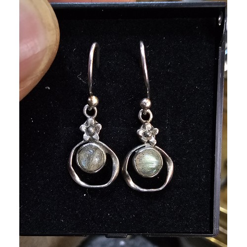 235 - A pair of pretty vintage 925 silver drop earrings, having a flower design set with rainbow moonstone... 