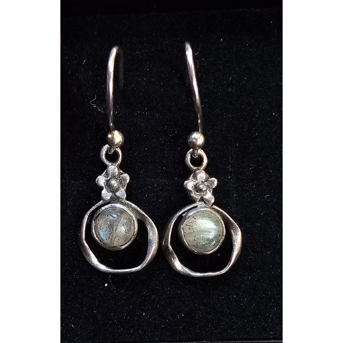 235 - A pair of pretty vintage 925 silver drop earrings, having a flower design set with rainbow moonstone... 