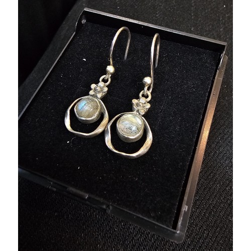 235 - A pair of pretty vintage 925 silver drop earrings, having a flower design set with rainbow moonstone... 