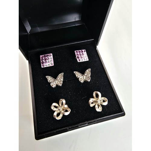 236 - 3 pairs of 925 silver stud earrings, to include  a very pretty pair of butterfat formed earrings set... 