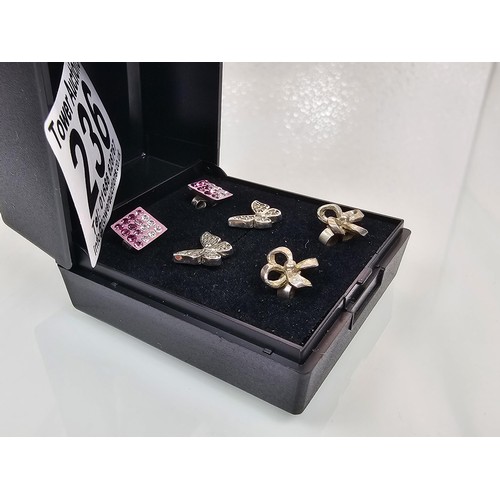236 - 3 pairs of 925 silver stud earrings, to include  a very pretty pair of butterfat formed earrings set... 