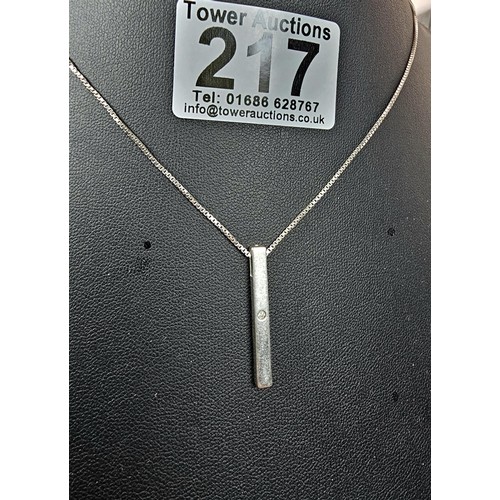 217 - A 925 silver pendant necklace featuring a bar formed silver pendant set with a real round cut diamon... 