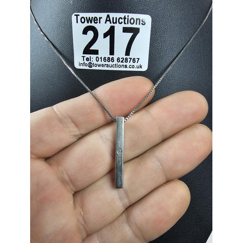 217 - A 925 silver pendant necklace featuring a bar formed silver pendant set with a real round cut diamon... 