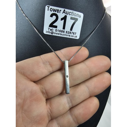 217 - A 925 silver pendant necklace featuring a bar formed silver pendant set with a real round cut diamon... 