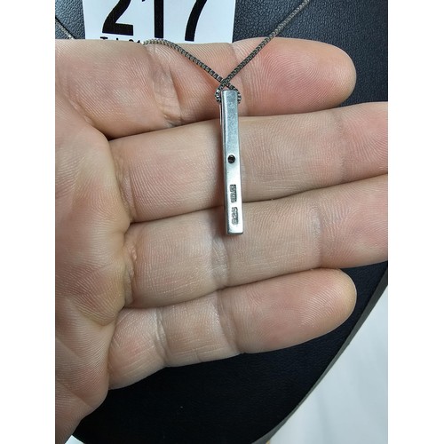 217 - A 925 silver pendant necklace featuring a bar formed silver pendant set with a real round cut diamon... 