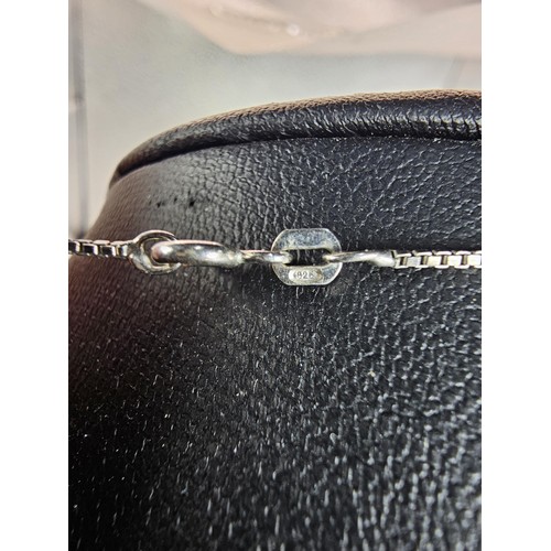 217 - A 925 silver pendant necklace featuring a bar formed silver pendant set with a real round cut diamon... 