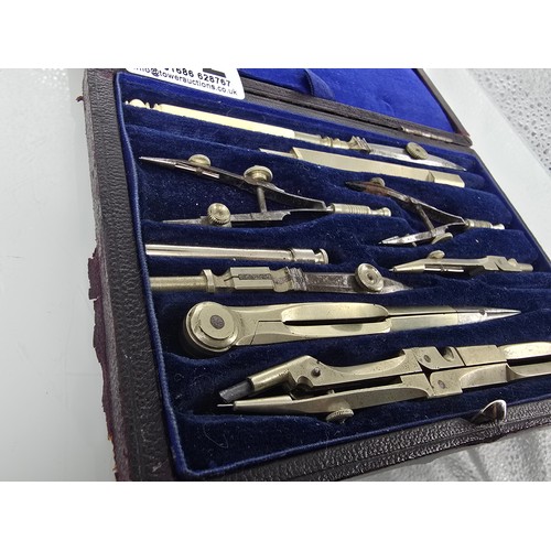 212 - A good quality vintage complete and cased technical drawing set, along with a vintage boxed unique e... 