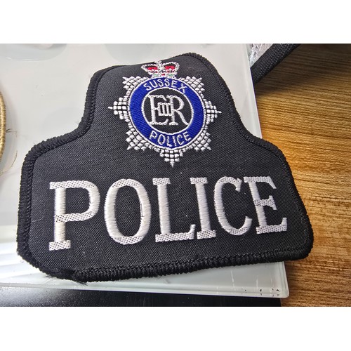 214 - A quantity of collectables to include, 2 original embroidered Police patches for Sussex  police and ... 