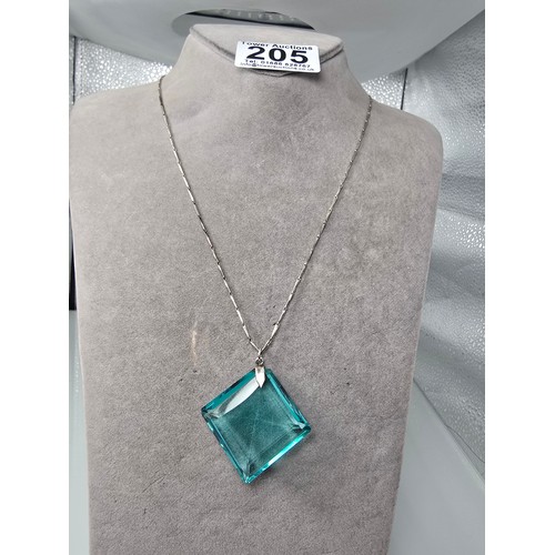 205 - A good quality 925 silver pendant necklace featuring a very large blue crystal glass faceted pendant... 