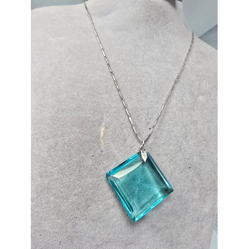 205 - A good quality 925 silver pendant necklace featuring a very large blue crystal glass faceted pendant... 