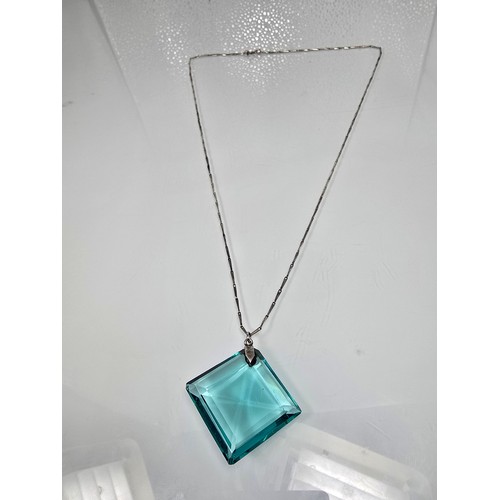 205 - A good quality 925 silver pendant necklace featuring a very large blue crystal glass faceted pendant... 