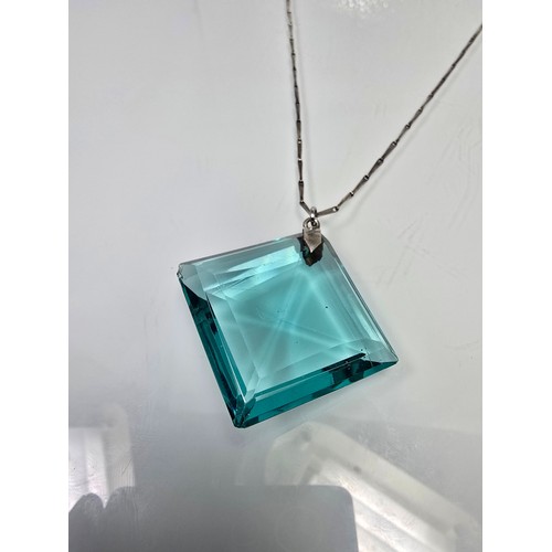 205 - A good quality 925 silver pendant necklace featuring a very large blue crystal glass faceted pendant... 