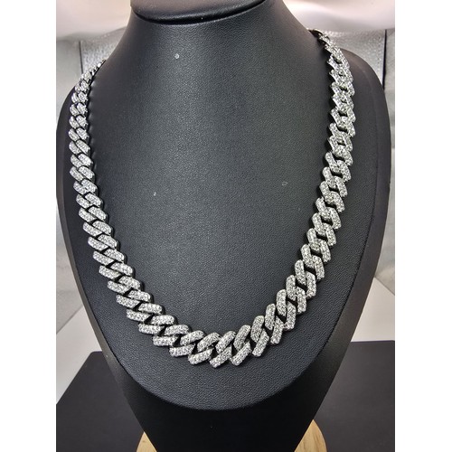 A brand new and boxed impressive silver plated iced neck chain with a ...