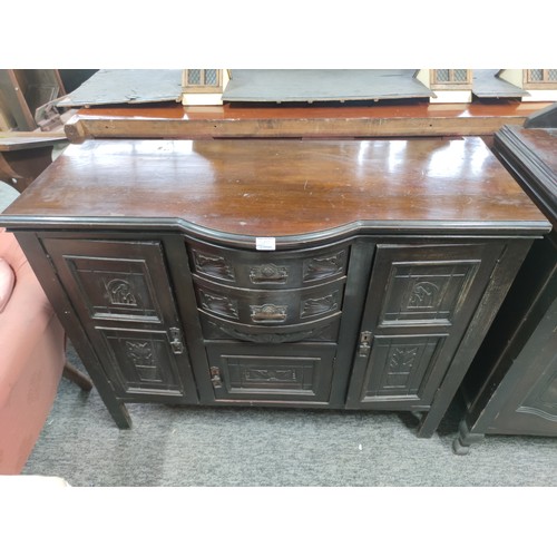 An early twentieth-century sideboard with a projecting bow-front centre ...