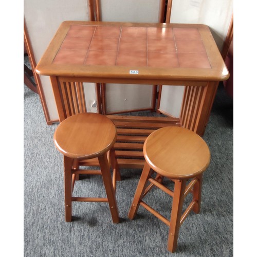 A wooden breakfast table with a rectangular top inset with twelve ...