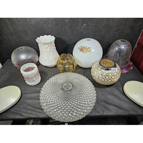 A collection of seven assorted glass lampshades, including two frosted ...