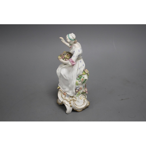 101 - A Chelsea figure of a lady holding a flower basket, c.1765, H. 17.5cm Condition: unmarked, restorati... 