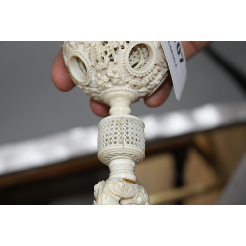 107 - A 19th century Chinese carved ivory concentric ball on stand, height 35cm Condition: Hairline crack ... 