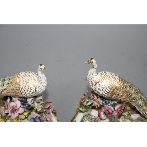 114 - A pair of Derby figures of peacocks, c.1840, red printed crown D mark, H. 15.5 and 16cm Condition: B... 