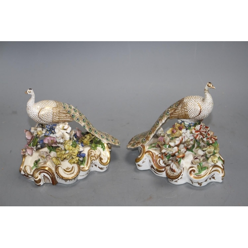 114 - A pair of Derby figures of peacocks, c.1840, red printed crown D mark, H. 15.5 and 16cm Condition: B... 