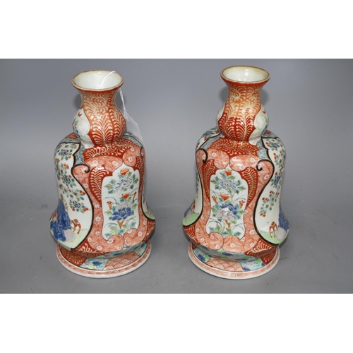 119 - A pair of Japanese enamelled porcelain huqqa base vases, decorated with figures, height 25cm Conditi... 