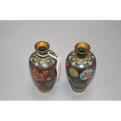 12 - A pair of Japanese cloisonne vases, height 15cm Condition: Minor firing spots and wear to the gildin... 