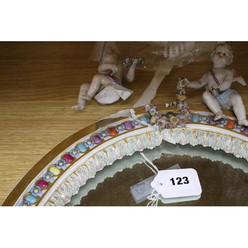 123 - A Meissen porcelain dressing table mirror, surmounted with cherubs (a.f.), overall height 56cm Condi... 