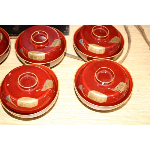 124 - A set of ten Japanese lacquer rice bowls and covers, with fitted box, Meiji / Taisho period, each fi... 