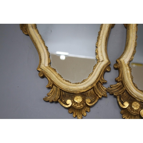 128 - A pair of Italian giltwood cartouche shaped wall mirrors, width 25cm, height 43cm Condition: Some mi... 