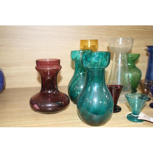 149 - Seven assorted Edwardian coloured glass hyacinth vases, a slender specimen vase and a thirteen other... 