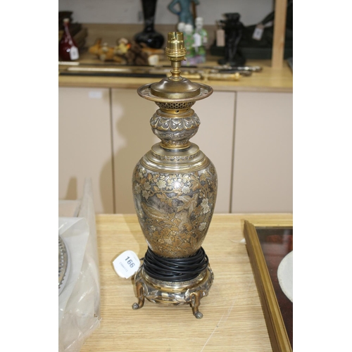 166 - A 19th century French silvered and gilt brass table lamp, decorated with Oriental style flowers, scr... 