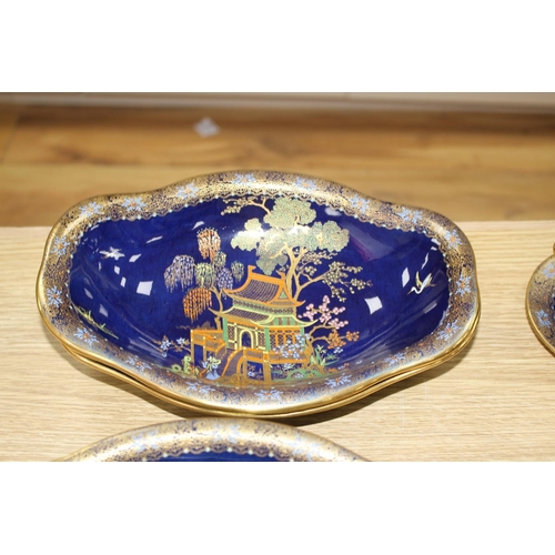 169 - A Carltonware thirty five piece coffee and dessert service, with chinoiserie decoration on a dark bl... 