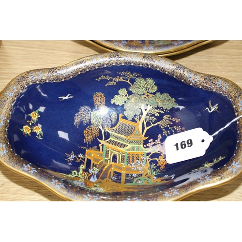 169 - A Carltonware thirty five piece coffee and dessert service, with chinoiserie decoration on a dark bl... 