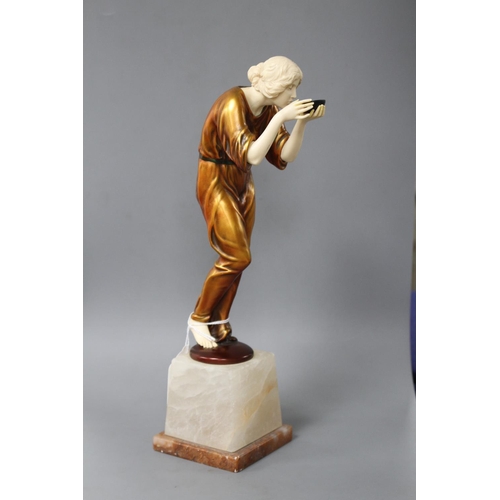 171 - An Art Deco style resin figure of a lady, height 28cm Condition: Lacks one foot, hairline crack at t... 