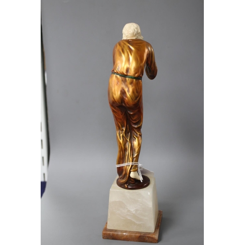 171 - An Art Deco style resin figure of a lady, height 28cm Condition: Lacks one foot, hairline crack at t... 