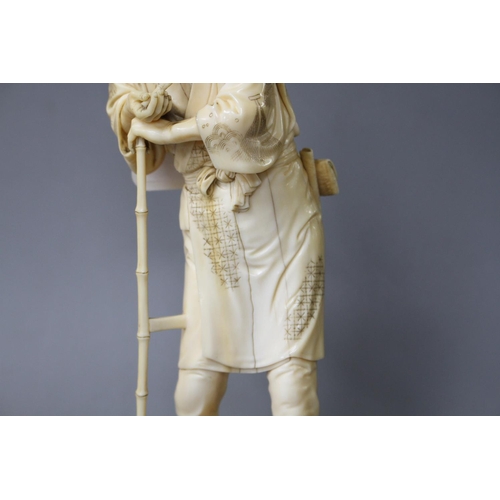 172 - A Japanese ivory Tokyo School ivory okimono, carved as a farmer above a chicken, Meiji period, signe... 