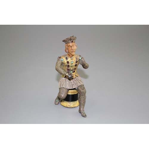 175 - An Austro-Hungarian gilt and white metal figure of a seated knight, with jewelled decoration and har... 