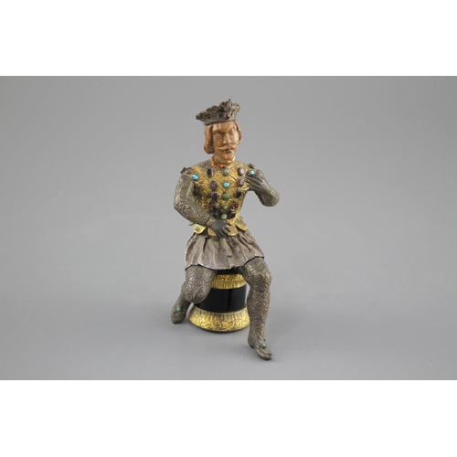 175 - An Austro-Hungarian gilt and white metal figure of a seated knight, with jewelled decoration and har... 