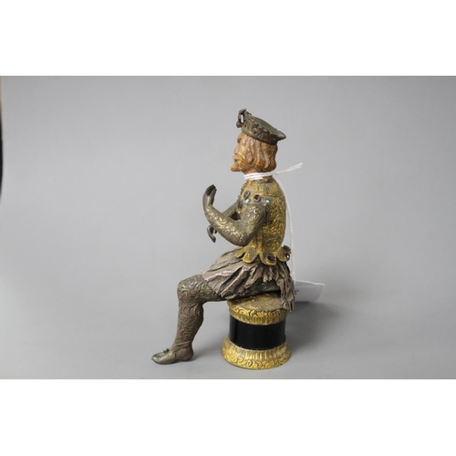 175 - An Austro-Hungarian gilt and white metal figure of a seated knight, with jewelled decoration and har... 