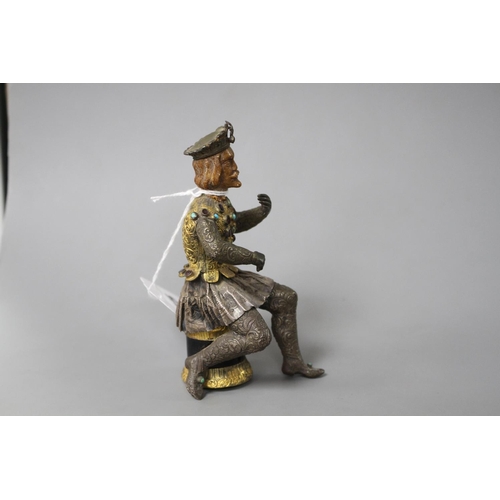 175 - An Austro-Hungarian gilt and white metal figure of a seated knight, with jewelled decoration and har... 